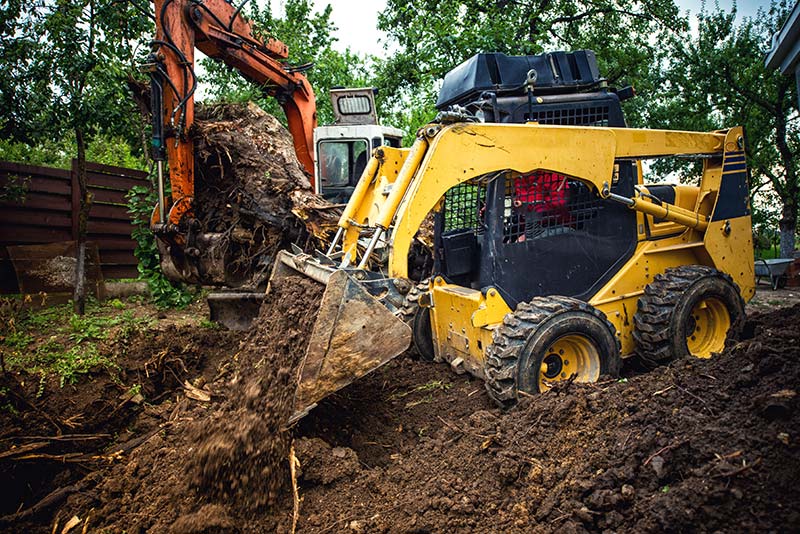 Wear Safety Toe boots when working with Landscape Construction equipment that can be dangerous