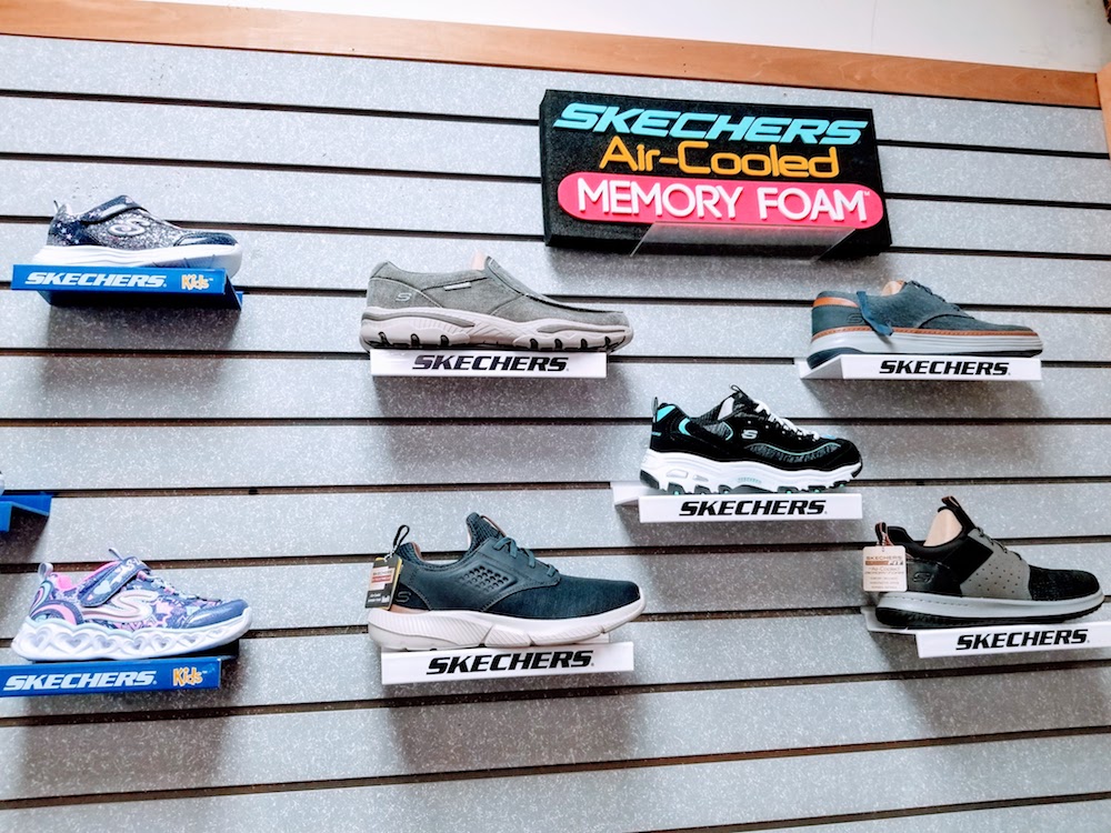Wall display of Skechers memory foam running shoes