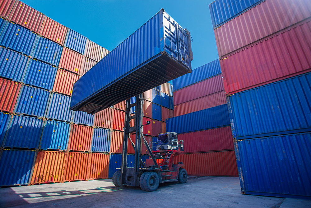 Back-up of shipping containers sitting at ports